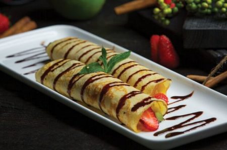 Crepes with bananas and strawberry