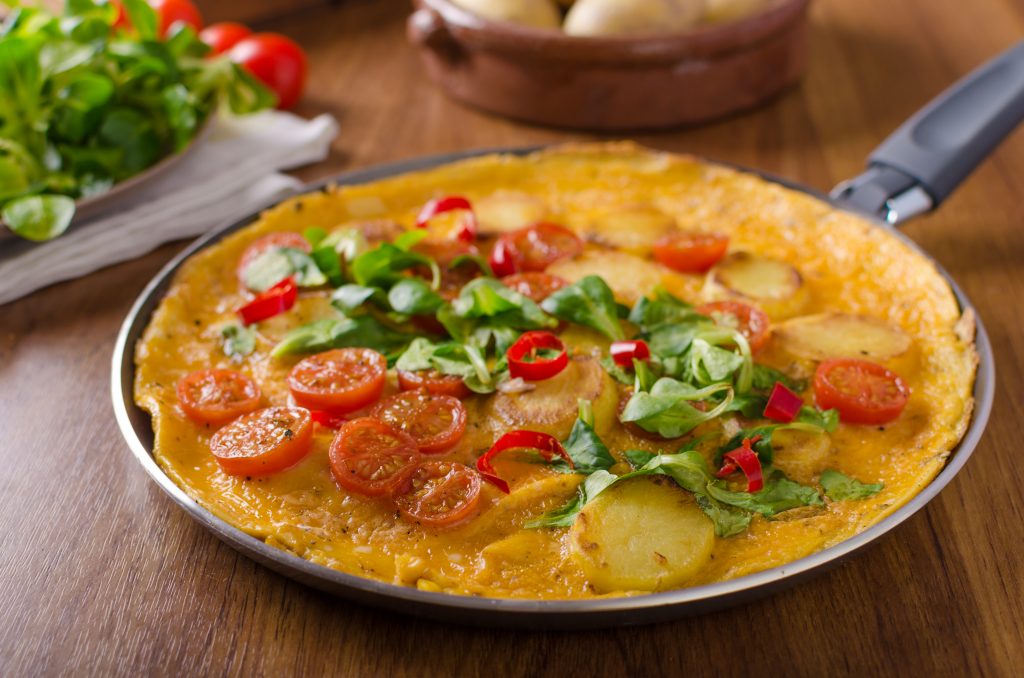 Frittata with tomatoes, herbs and chilli, little lettuce inside, very simple but delicious food